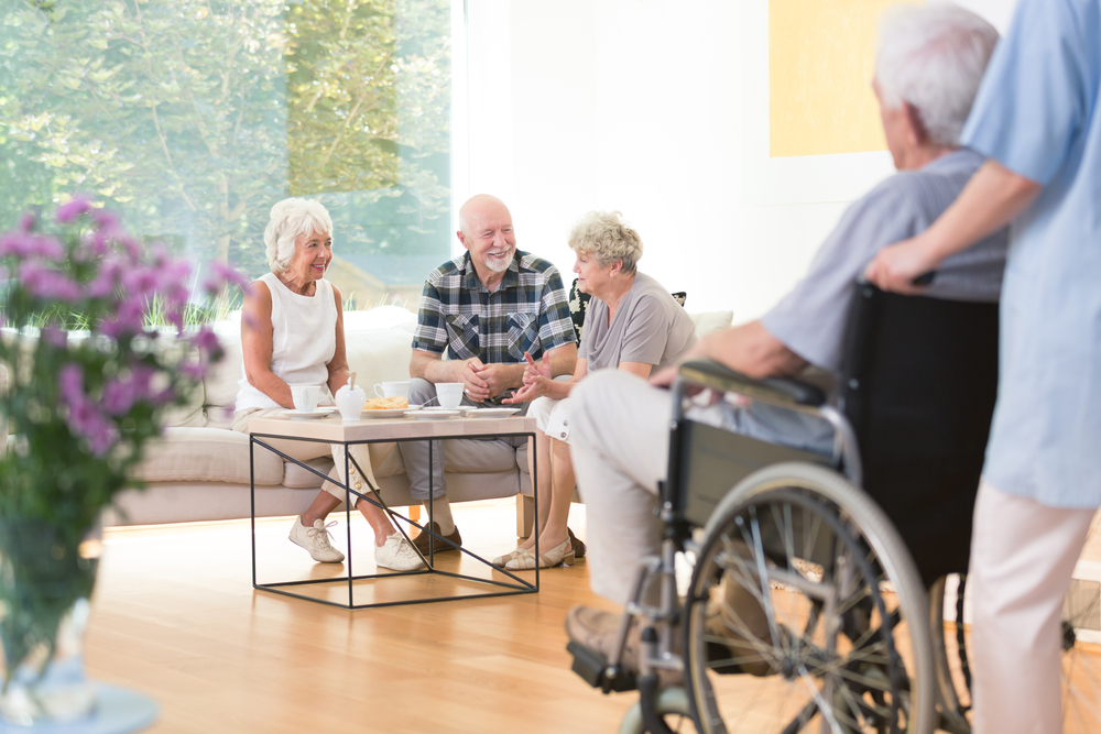 Senior citizens chatting in an assisted living home